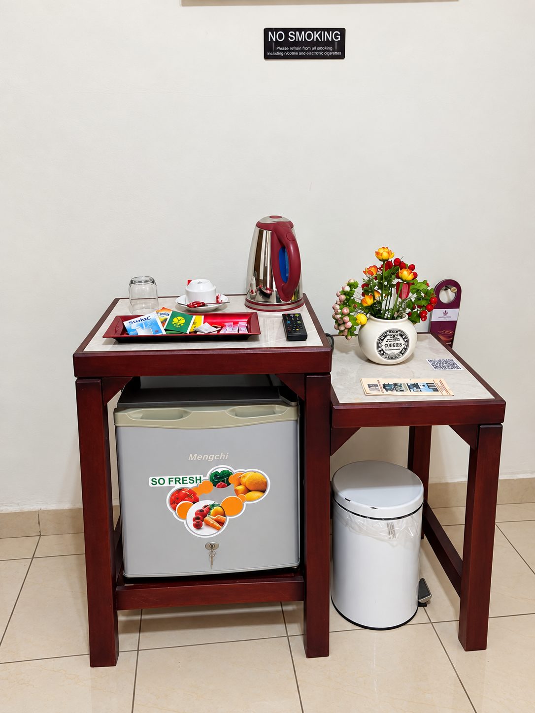 Mini fridge and bar amenity in the VIP Room at Hotel Omnisport